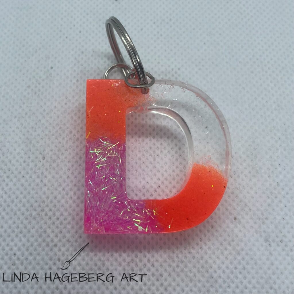 Nøkkelring D, orange og rosa