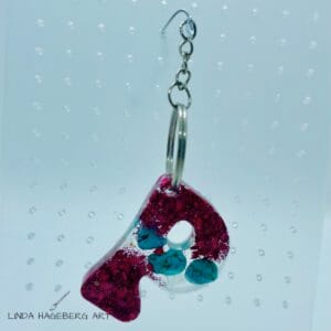 Nøkkelring P, rosa og turkis